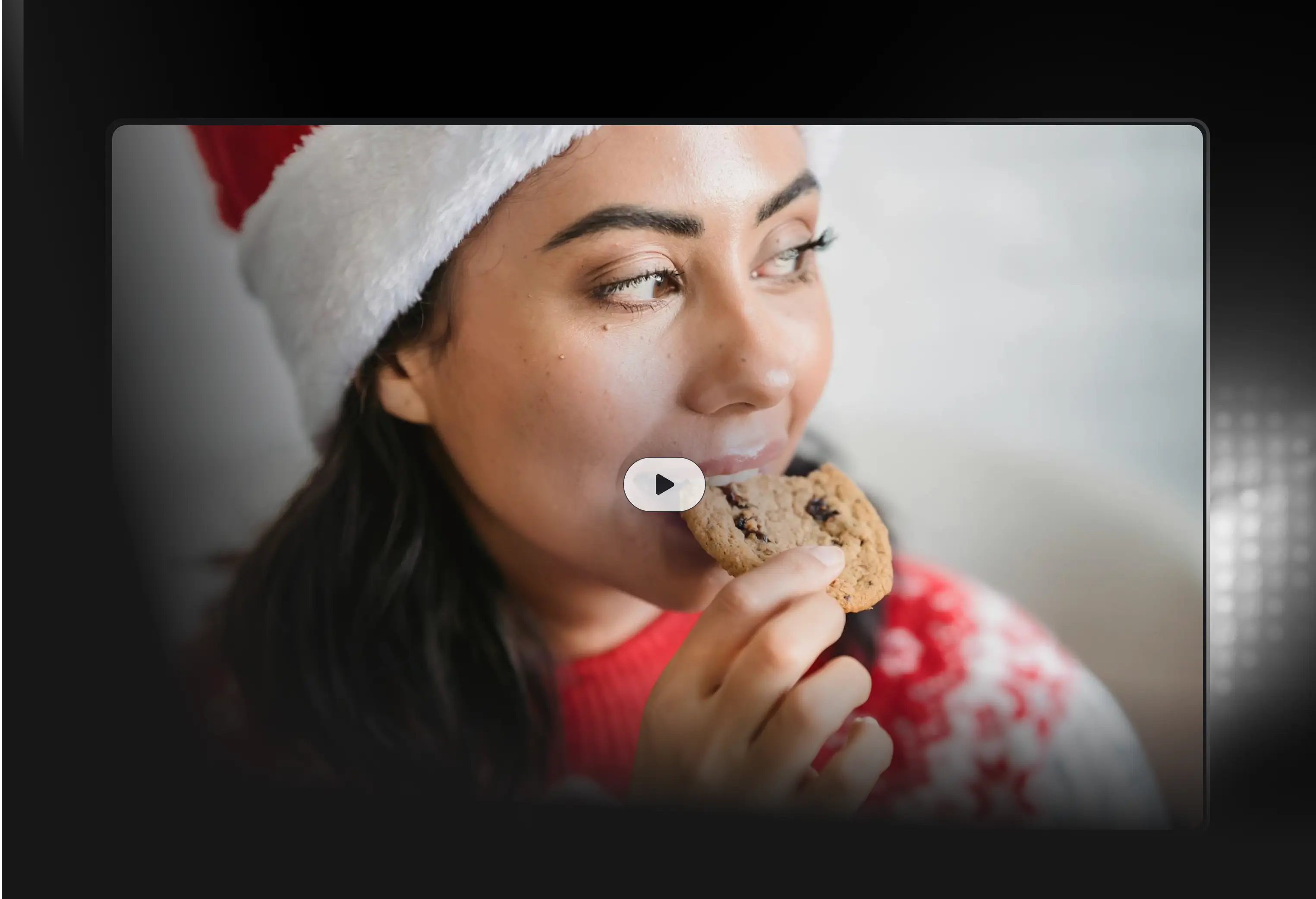 Video still of a woman eating a cookie